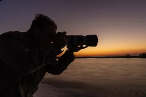 Guest-with-camera-gear-on-safari-in-Botswana-Pangolin-Photo-Safaris-scaled